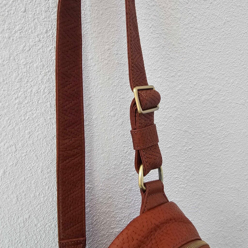 Leather textured sling pack
