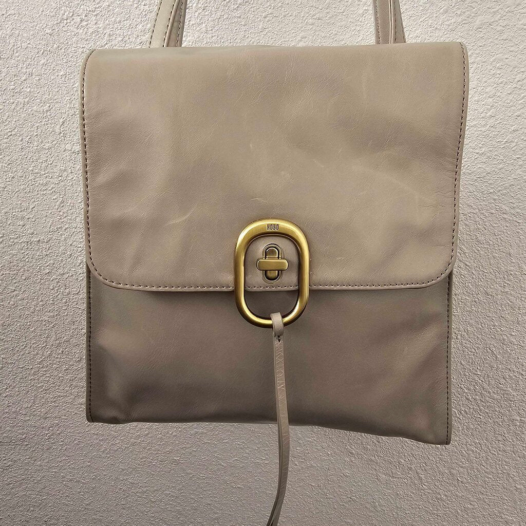 Leather turn lock backpack