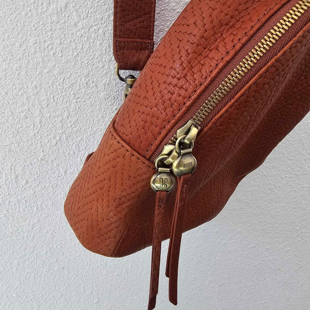 Leather textured sling pack