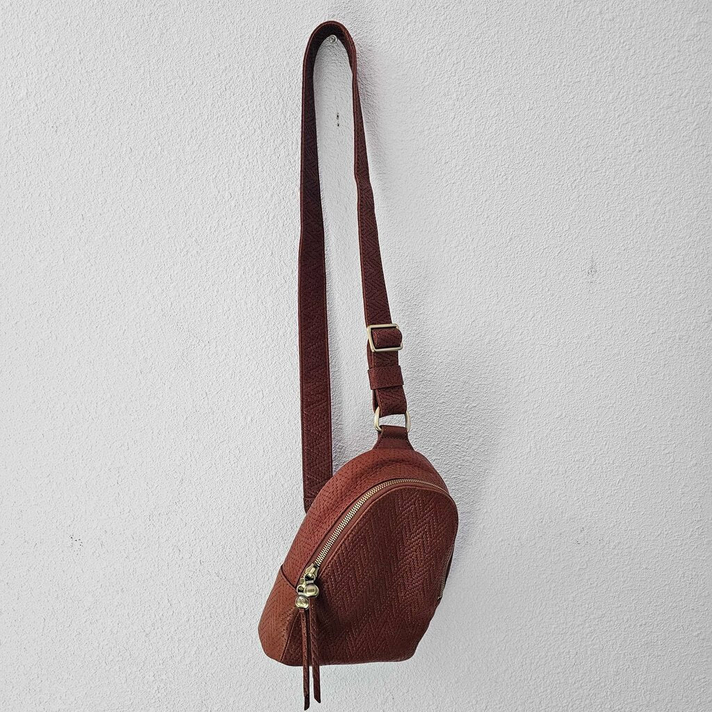 Leather textured sling pack