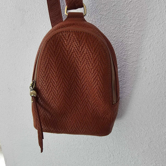 Leather textured sling pack
